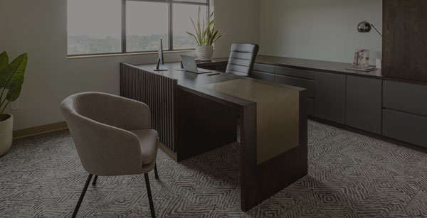 Wood home office desk with natural finish and storage drawers